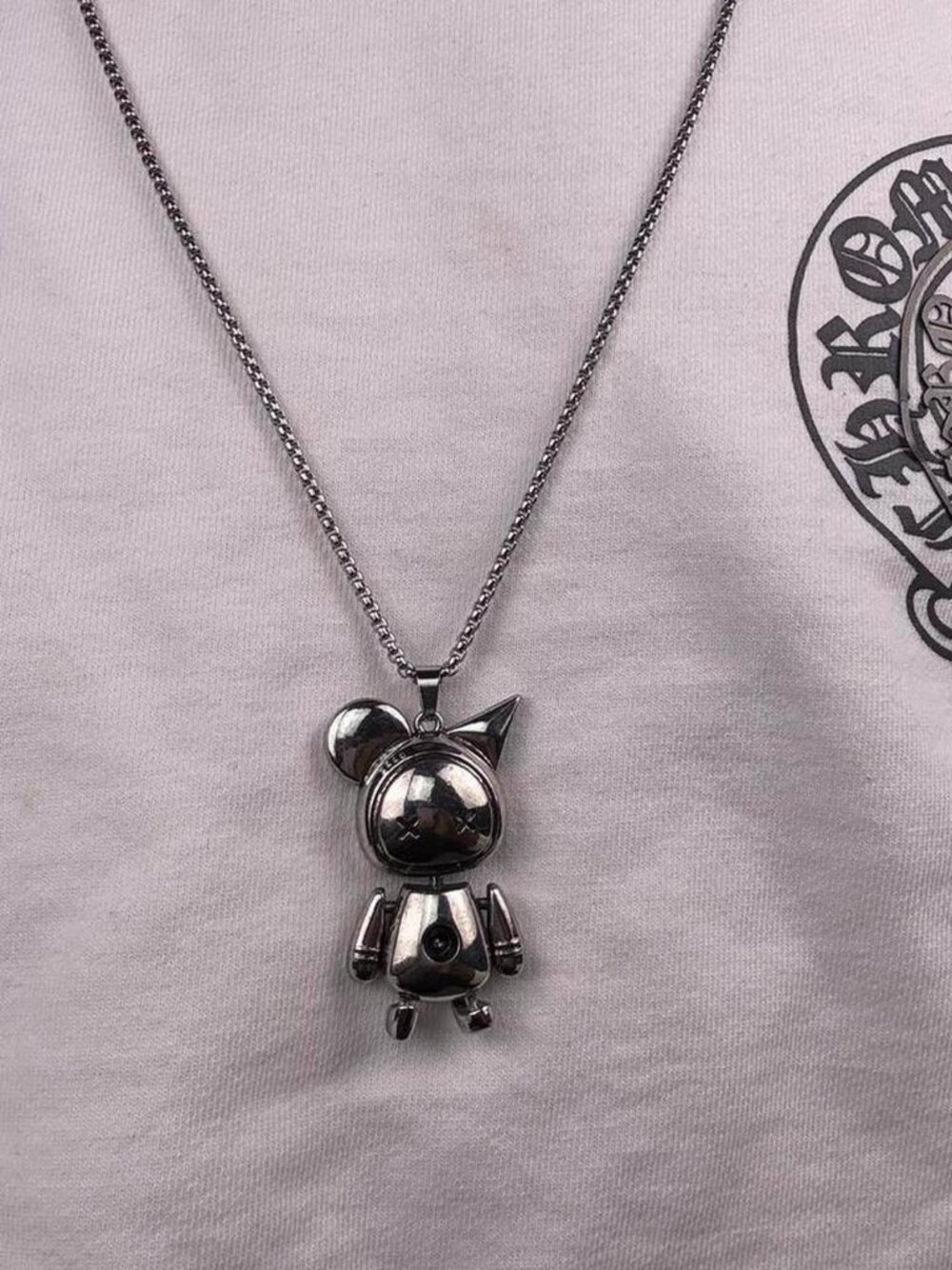 Silver‎ astronaut necklace